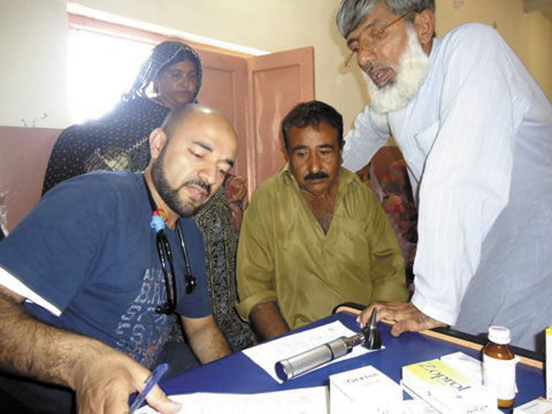 Dr. Irfan Ali, of Augusta, left, works with patients during a medical camp he offered while he was visiting family in Pakistan. For donating his time last November and other contributions, Ali, a hospitalist at MaineGeneral Medical Center’s Thayer unit in Waterville, is to receive the 2011 NASF Humanitarian of the Year award from the Chelsea-based Nasreen & Alam Sher Foundation at a dinner Saturday in Augusta.