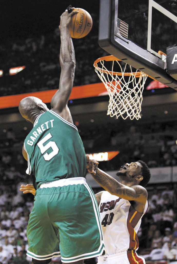 THAT’S THE TICKET: Boston Celtics’ center Kevin Garnett (5) dunks over Miami Heat’s Udonis Haslem (40) during the second half of the Celtics 94-90 win in Game 5 of the Eastern Conference finals Tuesday in Miami.