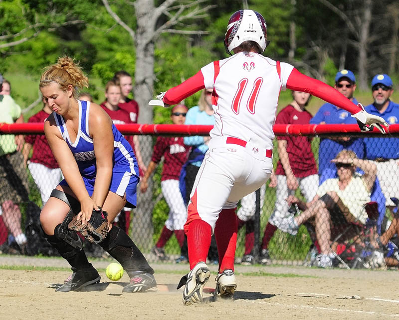Staff photo by Joe Phelan Cony hitter Sonja Morse is safe at first as the ball gets away from Erskine first baseman Shannon Blanchard during a preliminary game of the KVAC softball championship on Friday afternoon at Cony Family Field in Augusta. Nicole Rugan scored a run on Morse's hit.