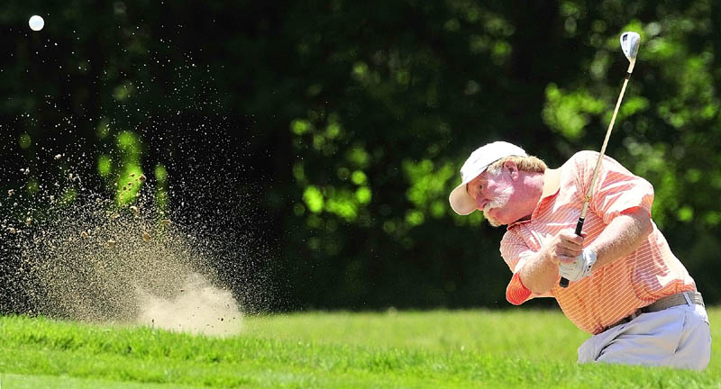 Staff photo by Joe Phelan Mark Plummer hits out of a bunker on second hole on the first day of the Charlie's Maine Open Championship on Tuesday at the Augusta Country Club in Augusta.