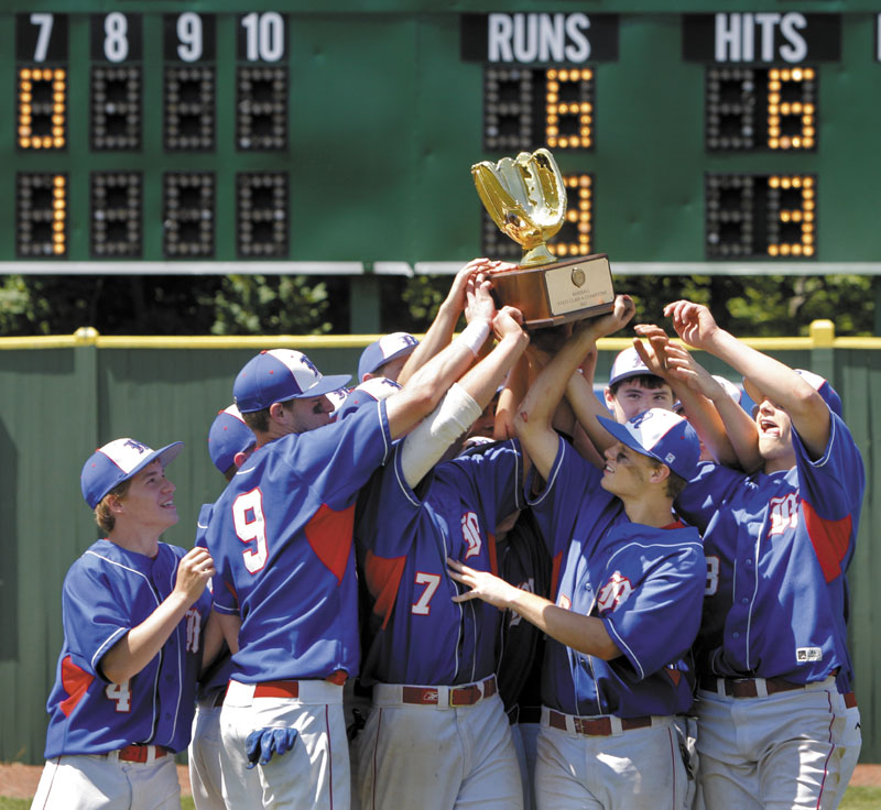 Gregory Rec/Staff Photographer: Messalonskee players hoist the championship trophy after defeating Scarborough 6-3 in the Class A state final baseball championship at St. Joseph's College in Standish on Saturday, June 16, 2012.