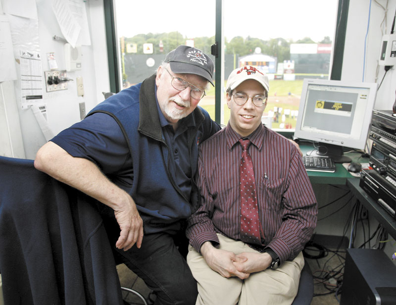 Special bond: Portland Sea Dogs announcer Dean Rogers sits with his son Mark at Hadlock Field in Portland recently. Mark, who has cerebral palsy, operates the Hadlock Field message board.