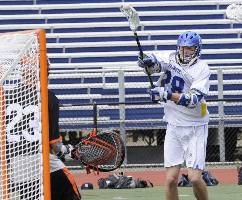 Charlie Fay, who scored three goals for Falmouth, whips a shot against North Yarmouth Academy goalie Weston Nolan during the Class B boys’ lacrosse state final Saturday at Fitzpatrick Stadium. Falmouth won, 7-4.