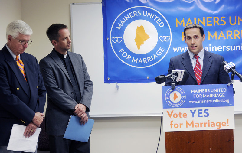 Matt McTighe, right, of Mainers United for Marriage speaks at a news conference Wednesday. He’s joined by John Paterson, president of the board of directors of the ACLU of Maine and former deputy Maine attorney general, and Michael Gray, pastor of Old Orchard Beach United Methodist Church.