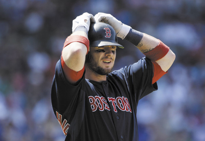 Boston Red Sox's Jarrod Saltalamacchia reacts after hitting a foul during the sixth inning of an interleague baseball game against the Chicago Cubs in Chicago, Friday, June 15, 2012. (AP Photo/Nam Y. Huh)