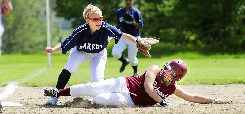 GET DOWN: Richmond baserunner Payton Johnson avoids a tag at third base by Greenville shortstop Miranda Drinkwater during the Bobcats’ 7-1 win in a Western Maine Class D semifinals Friday in Richmond.