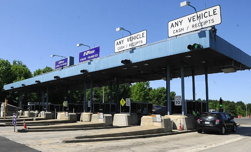 Vehicles go through the Mile 101 toll plaza on the Maine Turnpike on Friday in West Gardiner.