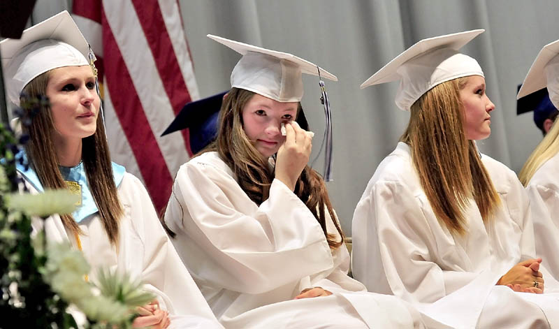 BITTERSWEET: Upper Kennebec Valley Memorial High School seniors got emotional during a personal address by fellow student Jennifer Hovey during commencement in Bingham on Sunday. From left are Richelle Miller, Alyssa Landry and Mikaela Frigon.