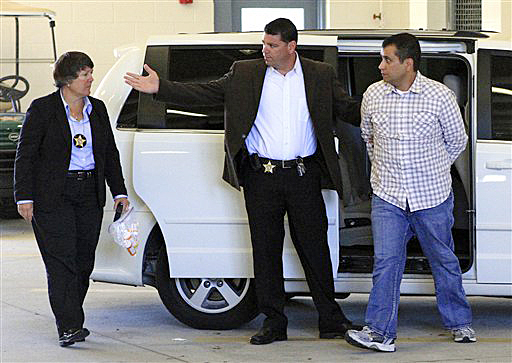 George Zimmerman, right, returns to the John E. Polk Correctional Facility in Sanford, Fla., today. Zimmerman is charged with second-degree murder in the shooting of Trayvon Martin.