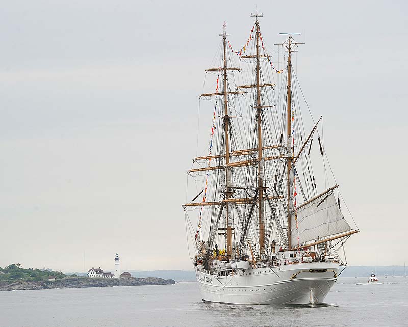 The 295 ft. US Coast Guard Cutter Eagle takes on passengers off Portland Headlight before entering Portland Harbor for a three day visit.
