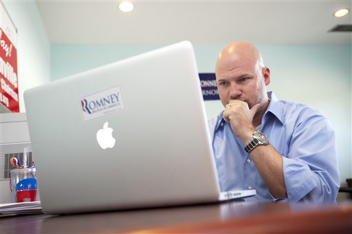 In this photo taken June 29, 2012, Matthew Gagnon volunteers working on a Facebook page for the Romney Victory Office in Fairfax, Va. Call them passionate, idealistic, earnest, even a tad naive: The volunteers helping to power the Obama and Romney campaigns are outliers at a time when polls show record low public satisfaction with government and a growing belief that Washington isn�t on their side. While motivated by opposing goals, the Obama and Romney volunteers share at least one key trait: an abiding faith in the political process and a belief that it still matters who occupies the White House. (AP Photo/Jacquelyn Martin)