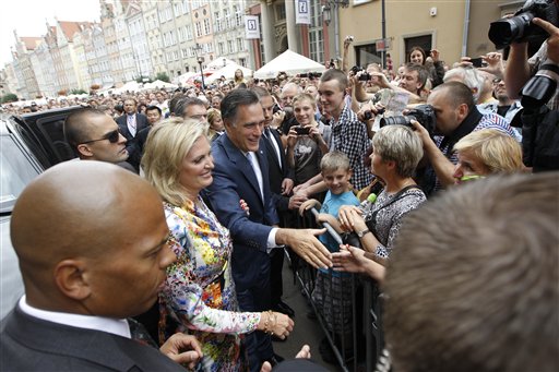 Republican presidential candidate and former Massachusetts Gov. Mitt Romney and wife Ann wave to the crowd at The Gdansk Old Town Hall, in Gdansk, Poland, Monday, July 30, 2012. (AP Photo/Charles Dharapak)