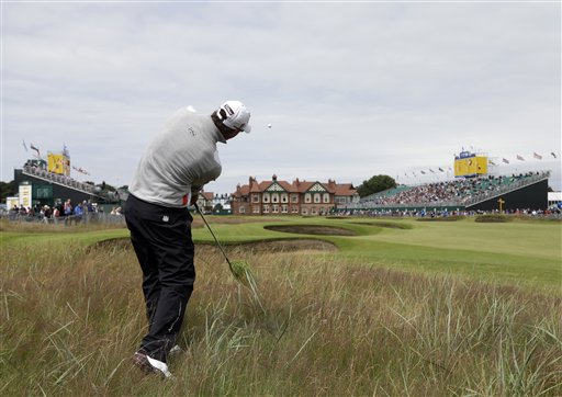 Adam Scott of Australia plays out of rough to the 18th green at Royal Lytham & St Annes golf club during the first round of the British Open Golf Championship, Lytham St Annes, England, Thursday, July 19, 2012. (AP Photo/Chris Carlson)