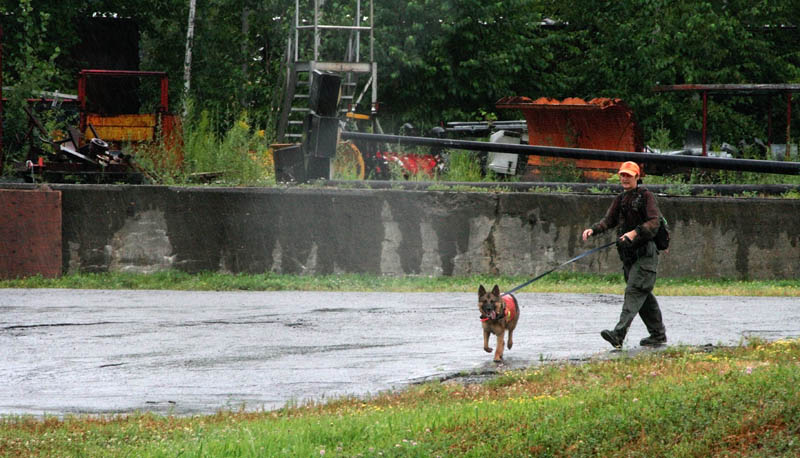 Debbie Palman, a volunteer with Maine Search and Rescue Dogs, helps with a search for Ayla Reynolds on Tuesday morning at the site of the former Scott Paper Mill in Winslow. Ayla was reported missing seven months ago today from her Waterville home.