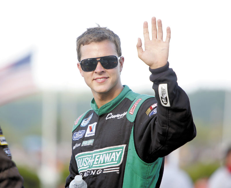 NASCAR driver Trevor Bayne waves to the crowd during driver introduction before the start of the TD Bank 250 on Sunday at Oxford Plains Speedway in Oxford.