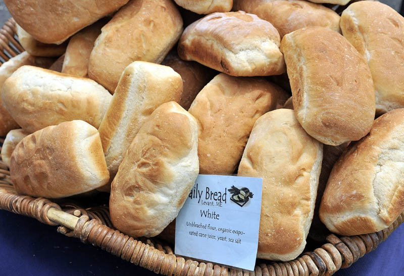 Fresh loaves from Daily Bread sit on display at the Daily Bread tent at the Artisan Bread Fair at the Skowhegan State Fairgrounds on Saturday.