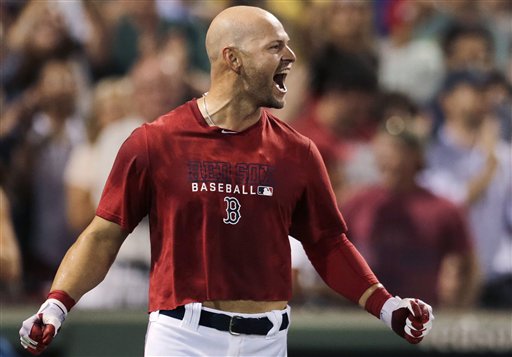 Boston's Cody Ross celebrates his three-run homer in the ninth inning Thursday night that gave the Red Sox a 3-1 win over the Chicago White Sox at Fenway Park.