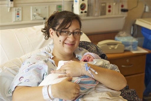 Katie Medley holds her newborn son Hugo Jackson Medley at University of Colorado Hospital in Aurora, Colo, on Tuesday.