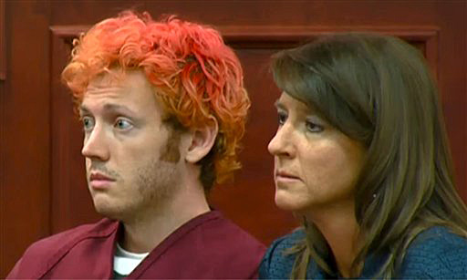 James Holmes, left, the suspected gunman in the Colorado theater massacre during his first appearance in court with his attorney Tamara Brady in Centennial, Colo. last Monday.