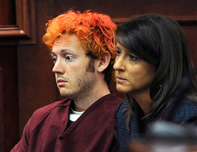 In this Monday, July 23 photo, James Holmes, accused of killing 12 people in Friday's shooting rampage in an Aurora, Colo., movie theater, appears in Arapahoe County District Court with defense attorney Tamara Brady in Centennial, Colo. Holmes was charged Monday, July 30, 2012 with 24 counts of murder. (AP Photo/Denver Post, RJ Sangosti, Pool, File)