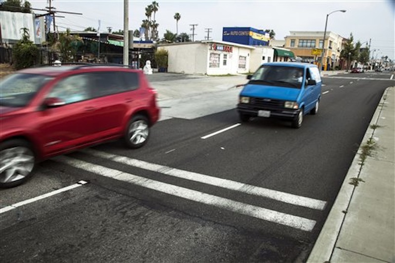 Traffic moves along the crossing where the U.S. Commerce Department Secretary John Bryson suffered a traffic accident last Saturday in San Gabriel, Calif., Monday, June 11, 2012. Bryson won't be charged, the district attorney's office said Tuesday, July 3, 2012. (AP Photo/Damian Dovarganes)