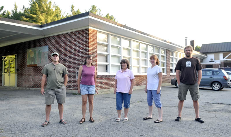 Cornville Regional Charter School organizers from left to right, executive director, Justin Belanger, and board members Sandra Belanger, Jean Walker, Jessica “Jake” Daigneault, and Jason Cooke outside the Cornville Elementary School on Wednesday.