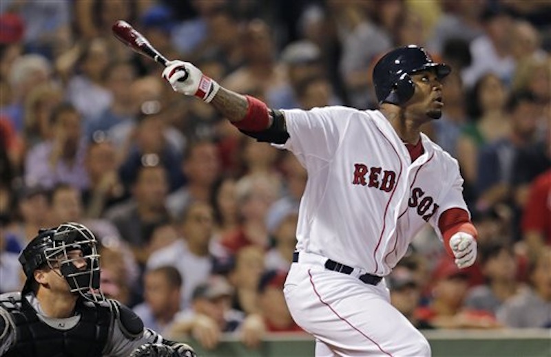 Boston Red Sox's Carl Crawford watches the flight of a fly out to center during the sixth inning of a baseball game against the Chicago White Sox at Fenway Park in Boston, Monday, July 16, 2012. Crawford returned to the line up after being on the 60-day disabled list. (AP Photo/Charles Krupa)