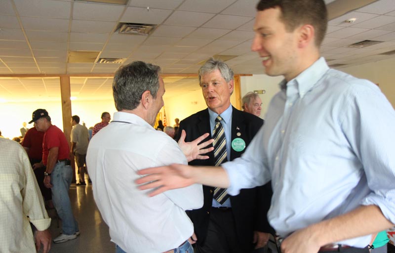 A SPECIAL MEETING: Attorney Tom Nale of Waterville, left, chats with acting District Attorney Alan Kelley of West Gardiner prior to a special meeting to nominate Kelley or Rep. Maeghan Maloney, D-Augusta, as the Democrat candidate to succeed Evert Fowle. The meeting was held at the Poulin-Turner Union Hall in Skowhegan. At far right, is Nale's son, Tom Nale, Jr.