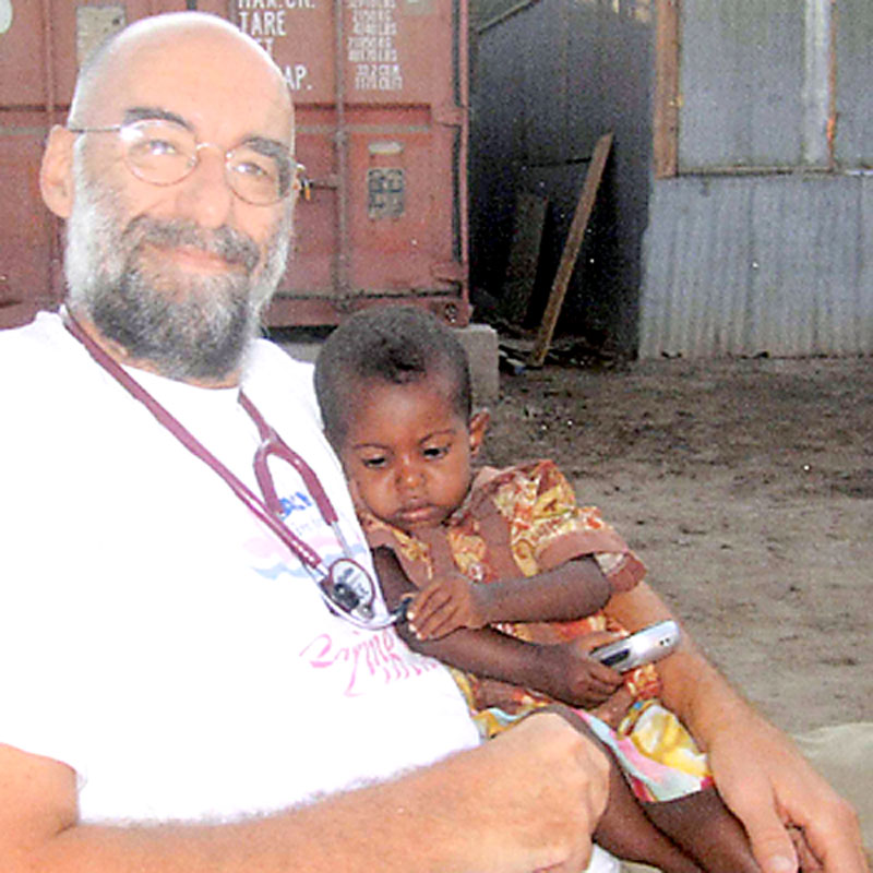Dr. David Austin holds a child he treated during his latest Doctors Without Borders assignment in Djibouti earlier this year.