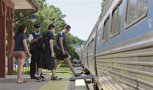 Passengers board Amtrak's Downeaster train at the station in Exeter, N.H. Associated Press photo