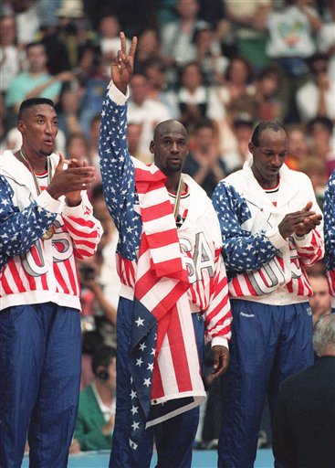 FILE -In this Aug. 8, 1992 photo, the USA's Scottie Pippen, left, with Michael Jordan, center, and Clyde Drexler, pose with their gold medals after beating in Barcelona. Jordan tells the Associated Press that� he laughed when heard Kobe Bryant said this year's USA Olympic basketball team could beat the Dream Team that Jordan played on. Jordan said "It's not even a question" who would have won that game. "We had 11 Hall of Famers on that team. Whenever they get 11 Hall of Famers you call and ask me." (AP Photo/Susan Ragan)