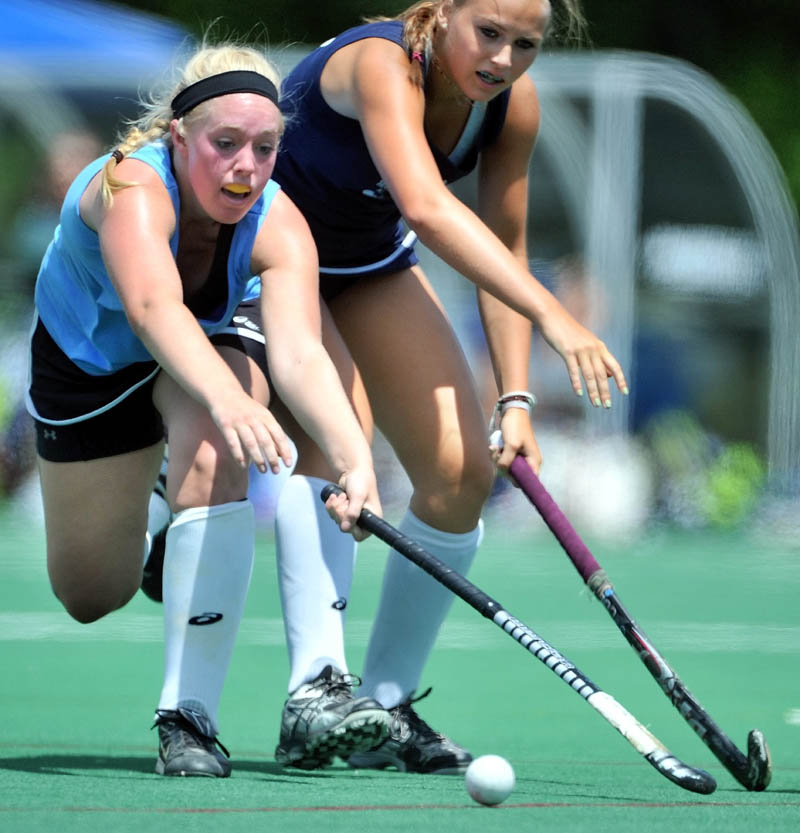 ALL-STARS: Mikayla Fitzmaurice, left, of Skowhegan and the East battles for the ball with West’s Alice Sandborn of Lake Region and the West in the McNally Senior All-Star field hockey game Saturday at Colby College. The East defeated the West 3-2.