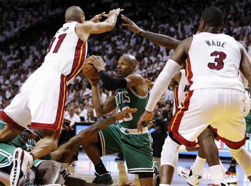 File - In this June 5, 2012, file photo, Boston Celtics' Ray Allen (20) looks to pass the ball as Miami Heat's Shane Battier (31) and Dwyane Wade (3) defend during the second half of Game 5 in their NBA basketball Eastern Conference Finals playoff series in Miami. Allen told the Heat on Friday night, July 6, 2012, that he has decided to leave the Celtics and join up with the reigning NBA champions. (AP Photo/Lynne Sladky, File)