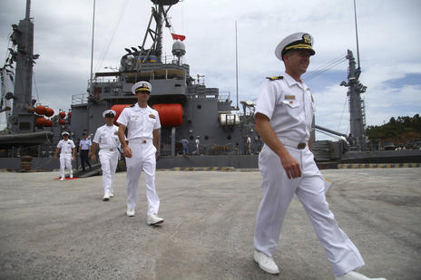 U.S. navy officers disembark a ship during a port call at Da Nang port, Da Nang, Vietnam, Friday, 15 July 2011. A treaty governing the high seas is all but dead in the Senate after two Republican senators announced their opposition Monday, July 16, 2012. Senate Republicans now have 34 votes to block it.