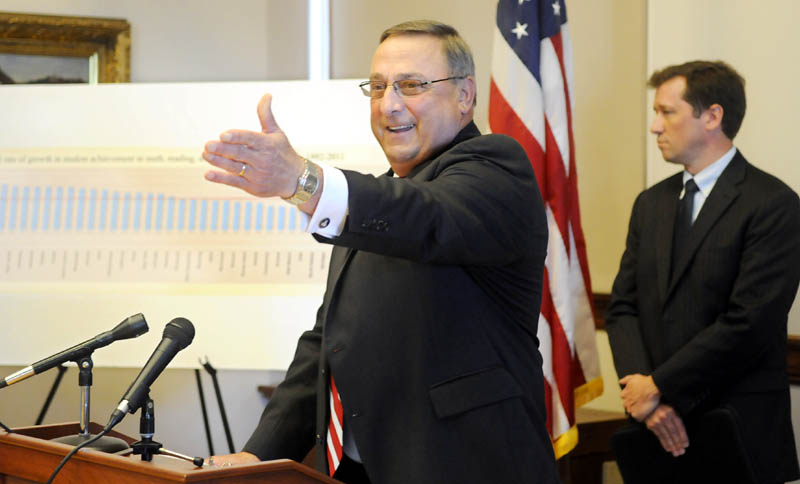 Governor Paul LePage and Commissioner of Education Stephen Bowen, right, react to a report by Harvard University's Program on Education Policy and Governance during a press conference Wednesday in Augusta.