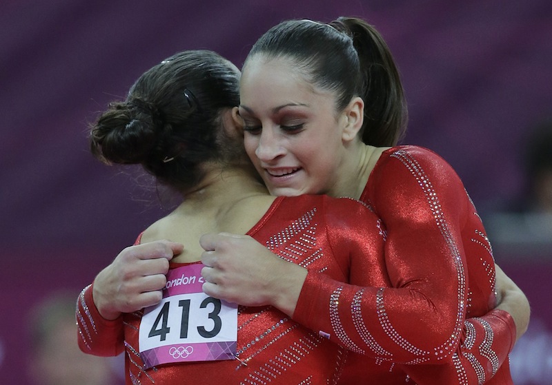 U.S. gymnast Jordyn Wieber, right, hugs U.S. gymnast Alexandra Raisman, after finishing her floor exercise during the Artistic Gymnastics women's team final at the 2012 Summer Olympics, Tuesday, July 31, 2012, in London. (AP Photo/Julie Jacobson) 2012 London Olympic Games Summer Olympic games Olympic games Sports Events XXX Olympiad