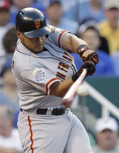 National League's Melky Cabrera, of the San Francisco Giants, hits a two-run home run during the fourth inning of the MLB All-Star baseball game Tuesday, July 10, 2012, in Kansas City, Mo. (AP Photo/Charlie Riedel)