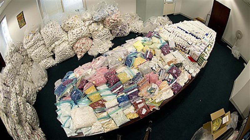 In this undated photo provided by the Federal Bureau of Investigation, a large supply of vials, pills and other medical supplies seized by the FBI in a drug diversion scheme are shown in the FBIís evidence room in New York. Prosecutors say that the scheme cheated Medicaid out of hundreds of millions of dollars by buying mountains of HIV medications and other drugs from down-and-out Medicaid recipients in New York City, then marketing the pills to pharmacies that dispensed them to unsuspecting consumers, authorities said Tuesday, July 17, 2012. (AP Photo/FBI, Matthew Coleman)
