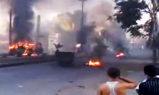 This image from amateur video released by the Ugarit News purports to show burning tires in Damascus. Anti-regime activists say government forces are shelling a number of neighborhoods in and around the capital a day after a bomb killed three members of President Bashar Assad's inner circle.