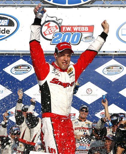 Brad Keselowski stands on his car as he celebrates in victory lane after winning the NASCAR Nationwide Series auto race at New Hampshire Motor Speedway, Saturday, July 14, 2012, in Loudon, N.H. (AP Photo/Autostock, Russell LaBounty) MANDATORY CREDIT 2012;F.W. Webb 200;NASCAR;Race;New Hampshire Motor Speedway;July;Nationwide Series;Loudon;New Hampshire;Autostock
