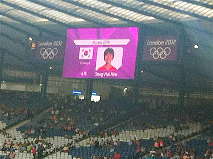 This photo cellphone shows a mistakenly displayed South Korean flag on a jumbo screen instead of North Korea's, before a women's soccer match that prompted the North Koreans to refuse to take the field for nearly an hour on Wednesday.