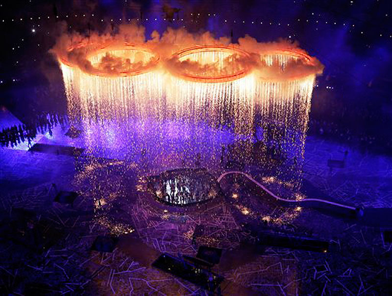 The Olympic rings light up the stadium during the Opening Ceremony at the 2012 Summer Olympics, Friday, July 27, 2012, in London. (AP Photo/Morry Gash, Pool) 2012 London Olympic Games Summer Olympic games Olympic games Spo