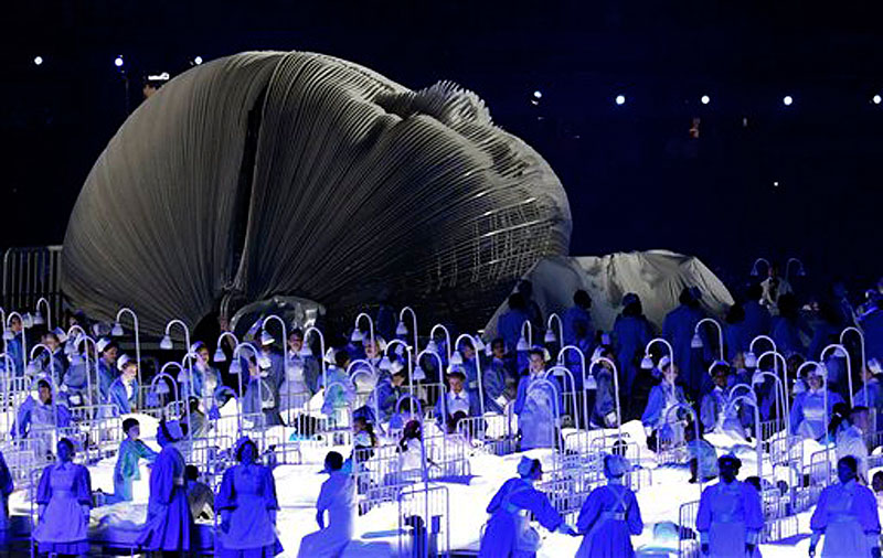 Actors perform in a sequence meant to represent Britain's National Health Service (NHS) perform during the Opening Ceremony at the 2012 Summer Olympics, Friday, July 27, 2012, in London. (AP Photo/Jae C. Hong) 2012 London Olympic Games Summer Olympic games Olympic games Spo