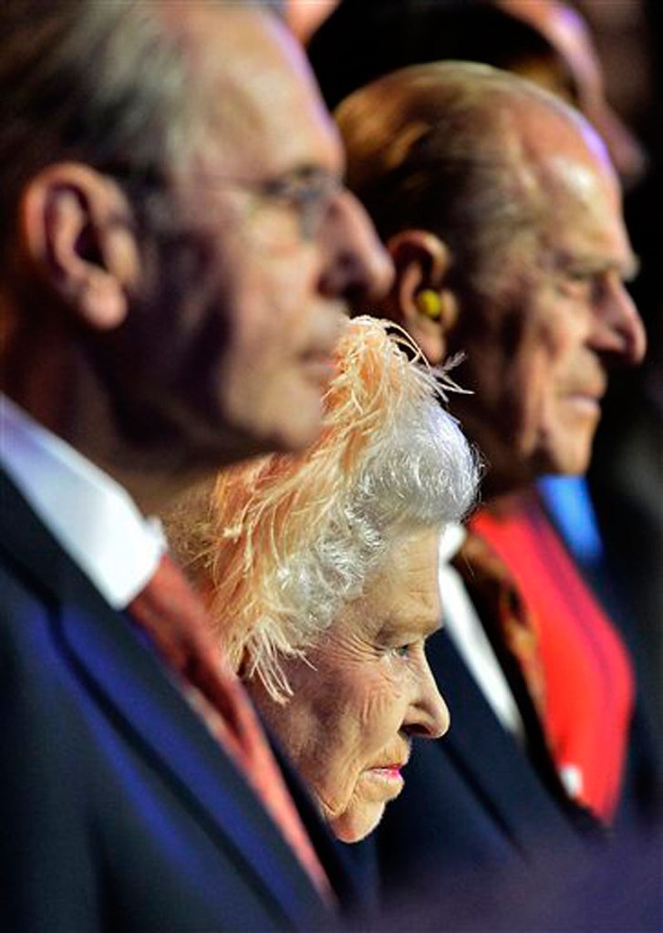 Britain's Queen Elizabeth II, center, Britain's Prince Philip, the Duke of Edinburgh, right, and IOC President Jacques Rogge, left, attend the Opening Ceremony of the 2012 Olympic Summer Games at the Olympic Stadium in London, Friday, July 27, 2012. (AP Photo/Toby Melville, Pool) 2012 London Olympic Games Summer Olympic games Olympic games Spo