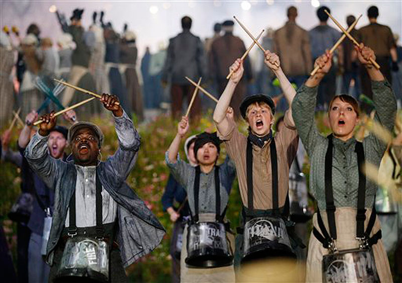Performers play drums during the Opening Ceremony at the 2012 Summer Olympics, Friday, July 27, 2012, in London. (AP Photo/Matt Dunham) 2012 London Olympic Games Summer Olympic games Olympic games Spo