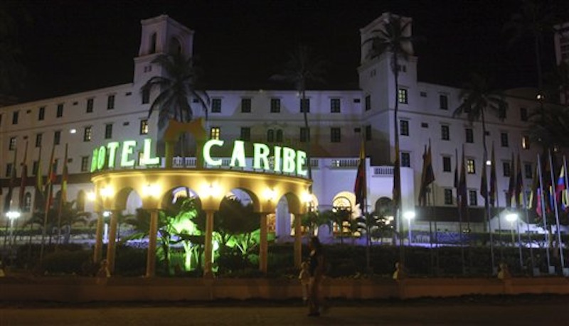 In this April 19, 2012, file photo, people walk past Hotel El Caribe in Cartagena, Colombia. Seven Army soldiers and two Marines have received administrative punishments, but are not facing criminal charges, for their part in the Secret Service prostitution scandal in Colombia this year, The Associated Press has learned. U.S. officials said that one Air Force member has been reprimanded but cleared of any violations of the Military Code of Justice. And final decisions are pending on two Navy sailors, whose cases remain under legal review. (AP Photo/Pedro Mendoza, File)
