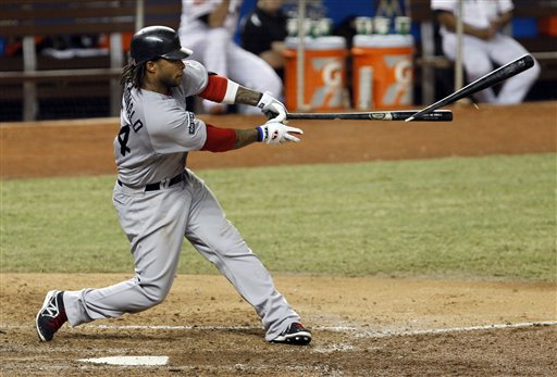Darnell McDonald breaks his bat on a base hit in a June 12, 2012, game the Miami Marlins. The Red Sox won 2-1.