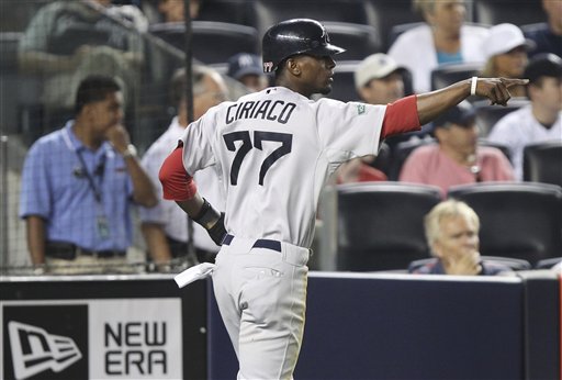 Boston Red Sox's Pedro Ciriaco gestures after scoring on a sacrifice fly by Dustin Pedroia during the ninth inning of the baseball game against the New York Yankees at Yankee Stadium in New York, Saturday, July 28, 2012. The Red Sox won 8-6. (AP Photo/Seth Wenig)