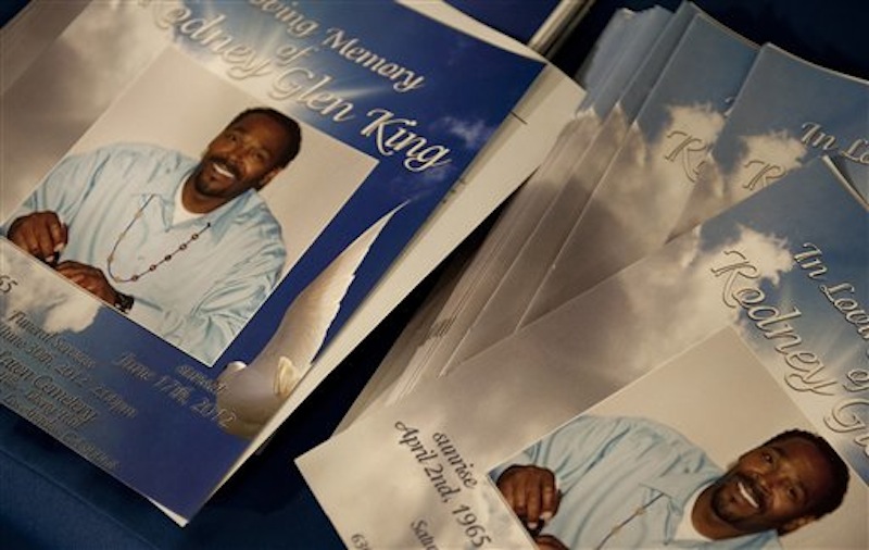 Stacks of programs for Rodney King's public memorial service lie in the Hall of Liberty at Forest Lawn-Hollywood Hills in Los Angeles on Saturday, June 30, 2012. King passed away earlier this month at 47. (AP Photo/Grant Hindsley)