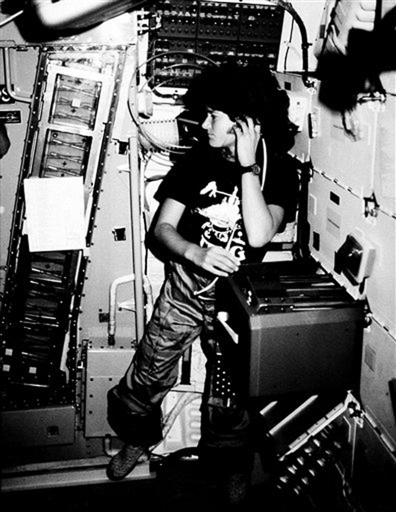 In this June 1983 file photo provided by NASA, astronaut Sally K. Ride, STS-7 mission specialist, communicates with ground controllers from the mid-deck of the earth-orbiting Space Shuttle Challenger. Ride, the first American woman in space, died Monday, July 23, 2012 after a 17-month battle with pancreatic cancer. She was 61. (AP Photo/NASA, File)